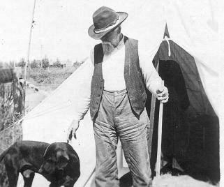 Isaac Perry Decker with dog and tent